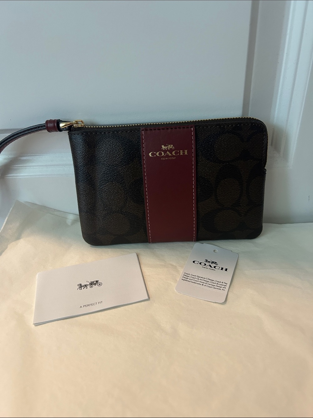 Coach Brown Signature Wristlet with Burgundy Center Panel
